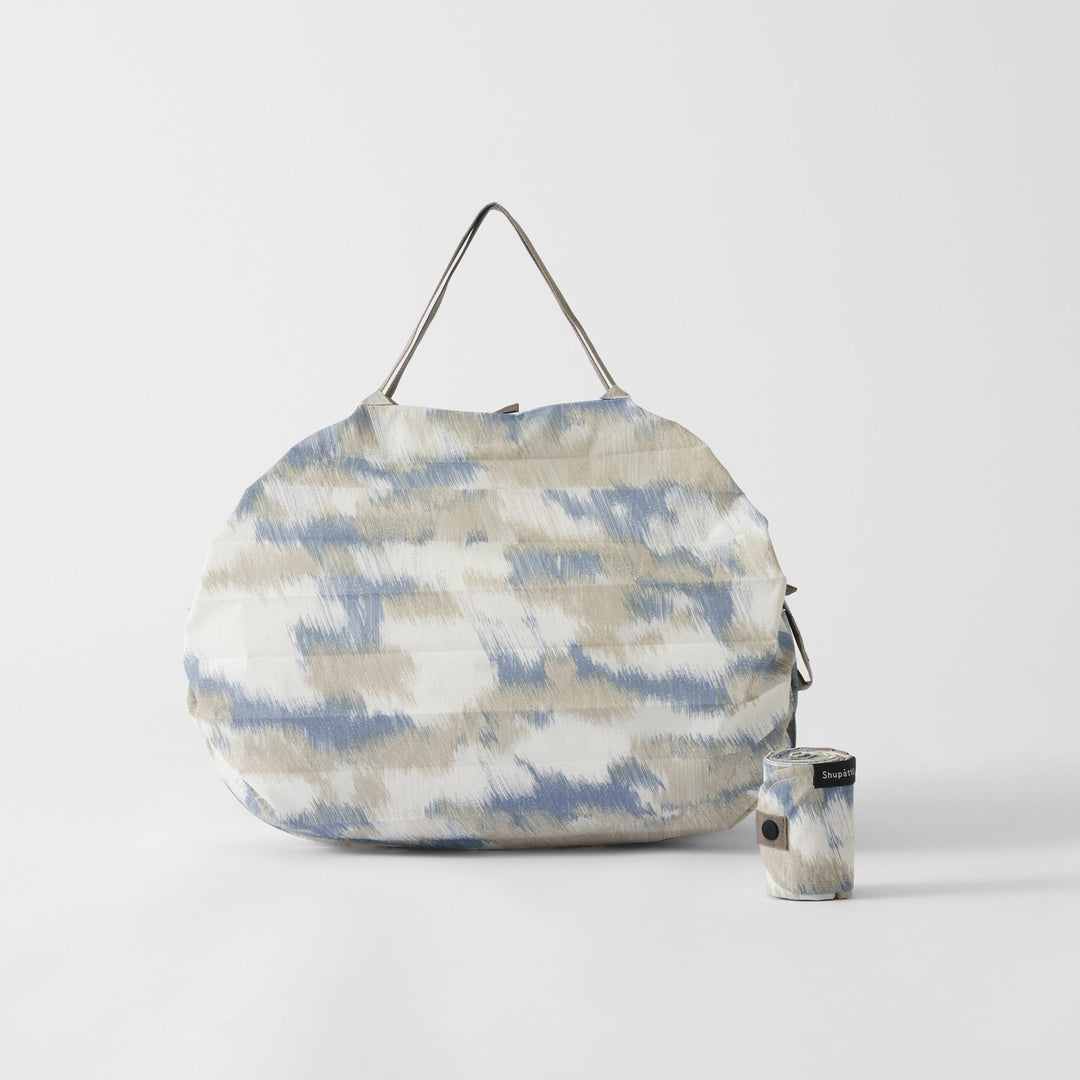 Shupatto Einkaufstasche Falttasche Shupatto - Floating Clouds - medium bei Nauli and Stories