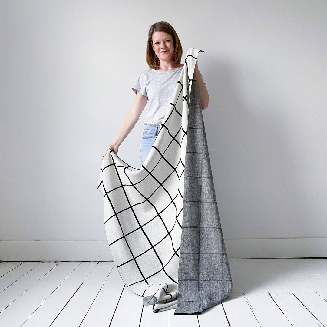 Sophie Home Sofadecke Strickdecke aus Baumwolle — Gitter: Schwarz bei Nauli and Stories