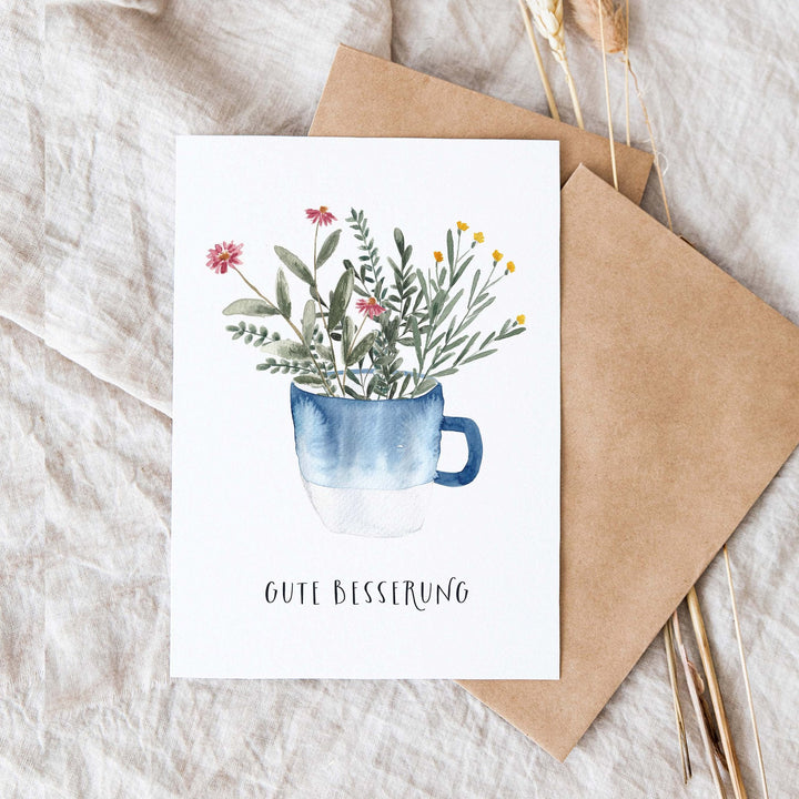 Paperlandscape Genesung Genesungskarte Gute Besserung mit blauer Tasse bei Nauli and Stories