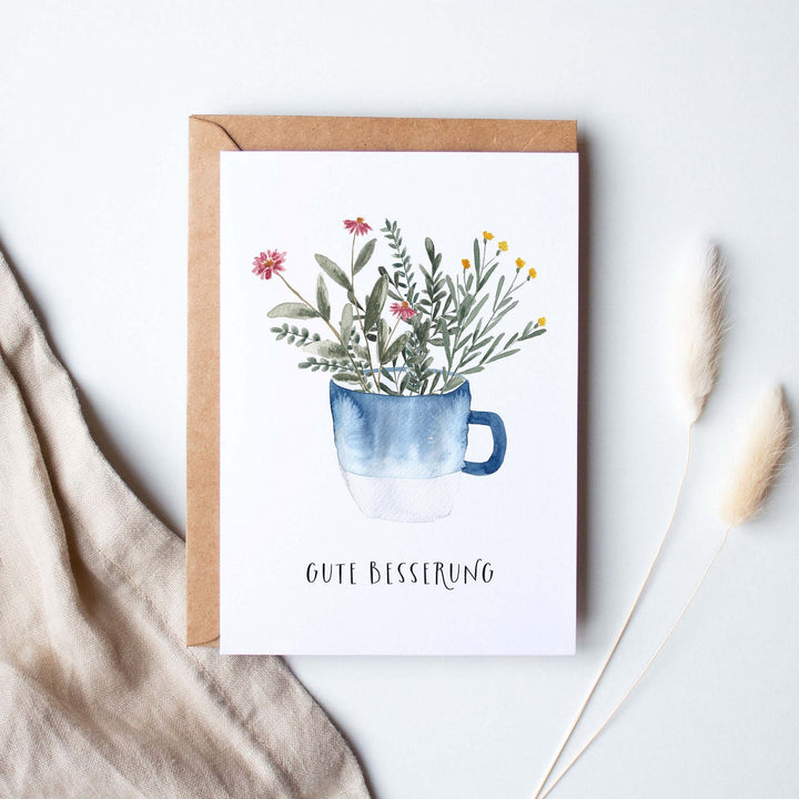 Paperlandscape Genesung Genesungskarte Gute Besserung mit blauer Tasse bei Nauli and Stories