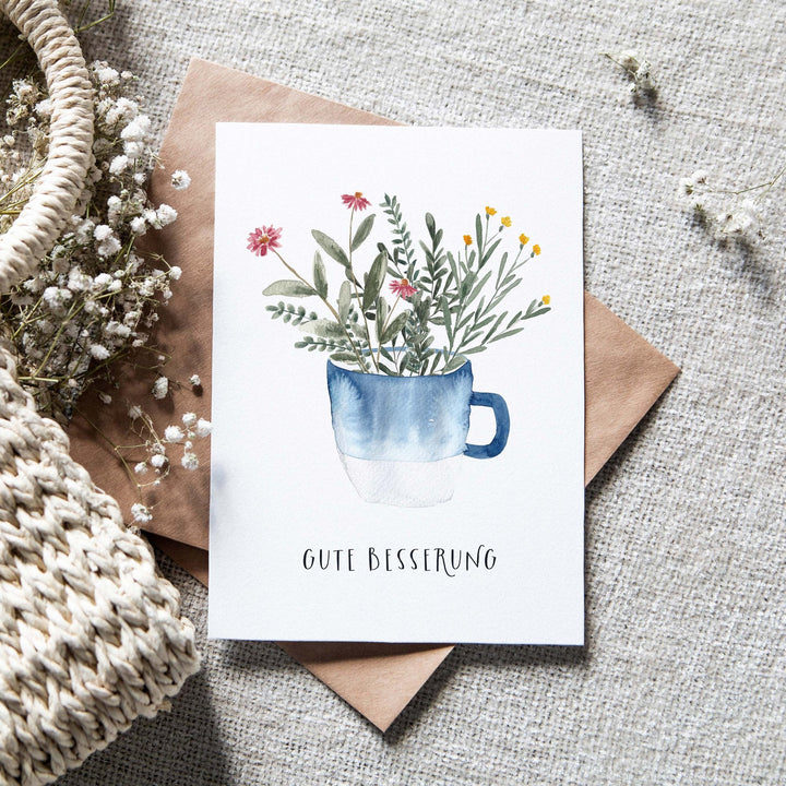 Paperlandscape Genesung Genesungskarte Gute Besserung mit blauer Tasse bei Nauli and Stories