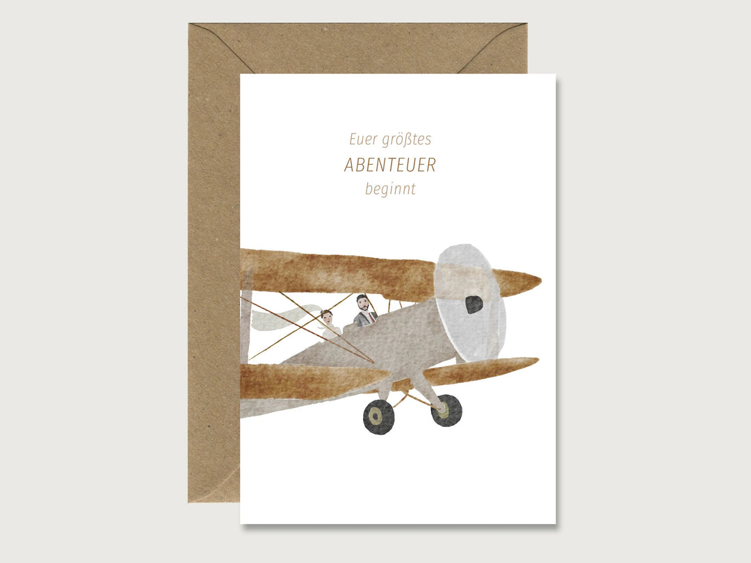 Herz & Papier Hochzeitskarte Hochzeitskarte - Euer größtes Abenteuer beginnt - Ehepaar mit Flugzeug
