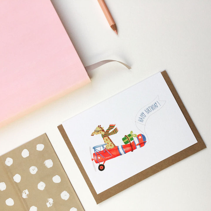 Pink Cloud Studio Grußkarte Grußkarte zum Geburtstag Giraffe im Flugzeug - Geburtstagskarte